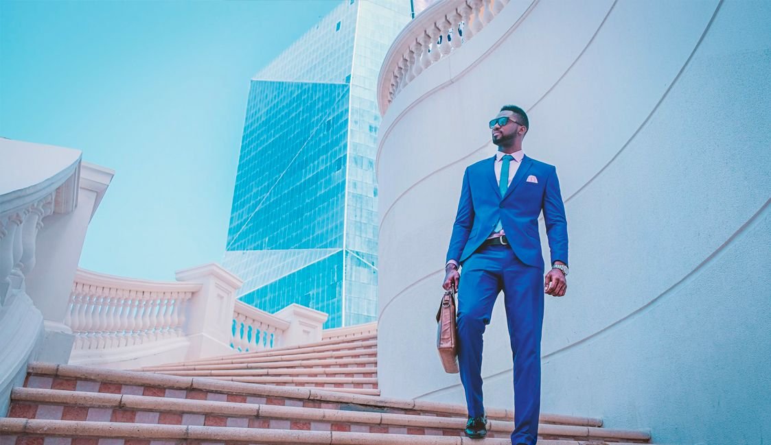 Man in Suit Walking Down Stairs